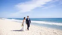 SJDIF-P0461-Beach-Wedding-Couple-Holding-Hands.16x9
